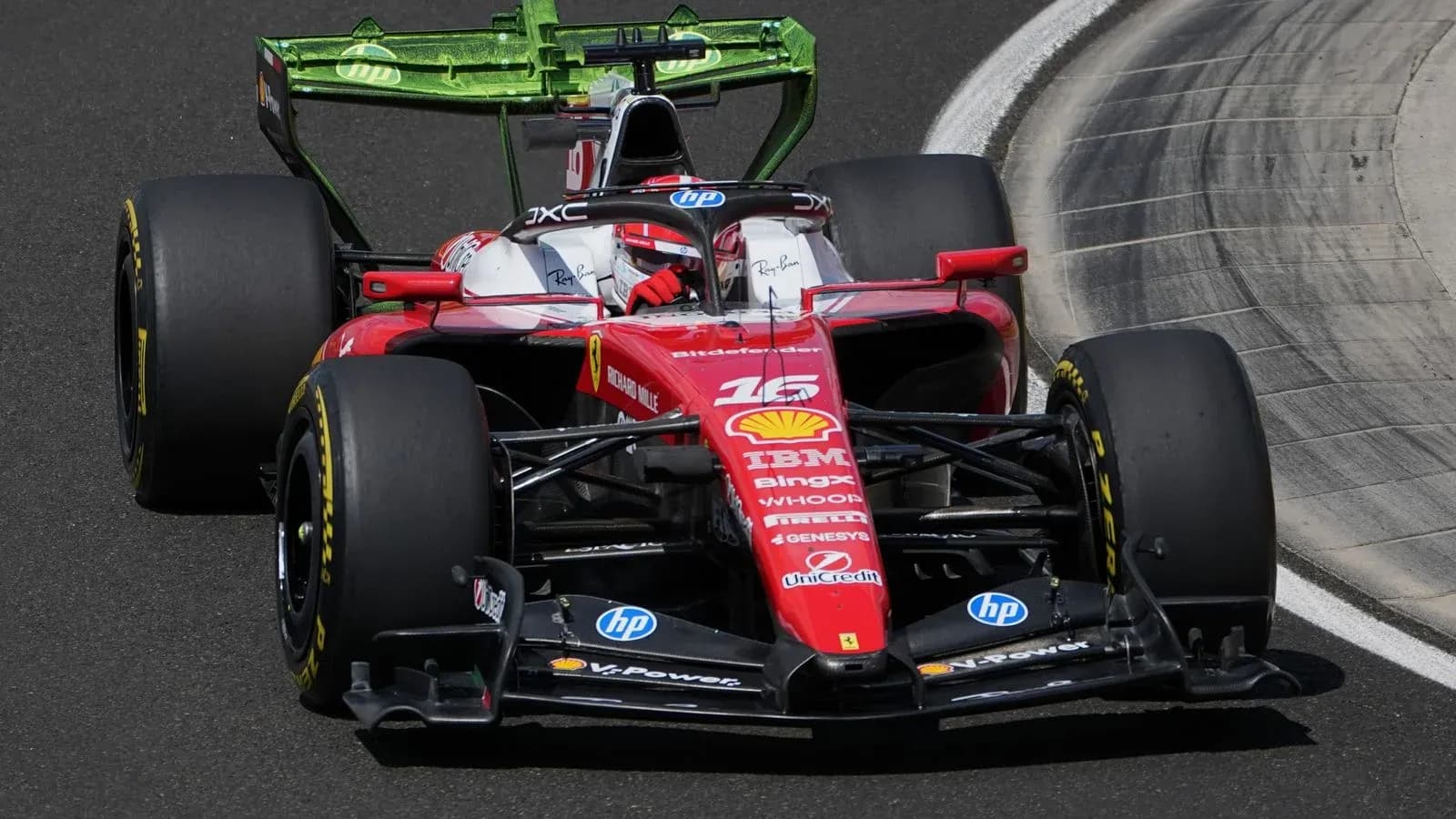 Ferrari F1 car racing on track during competition