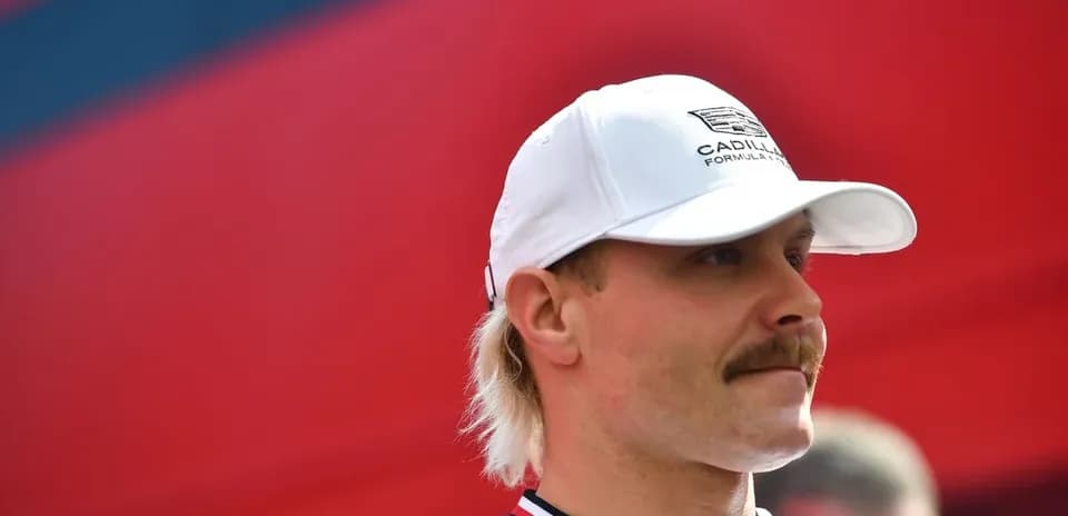 Racing driver in white cap and shirt