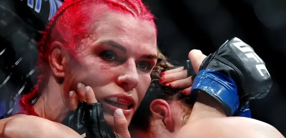 Two fighters grappling during UFC match
