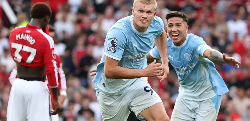 Erling Haaland celebrating a goal with teammates