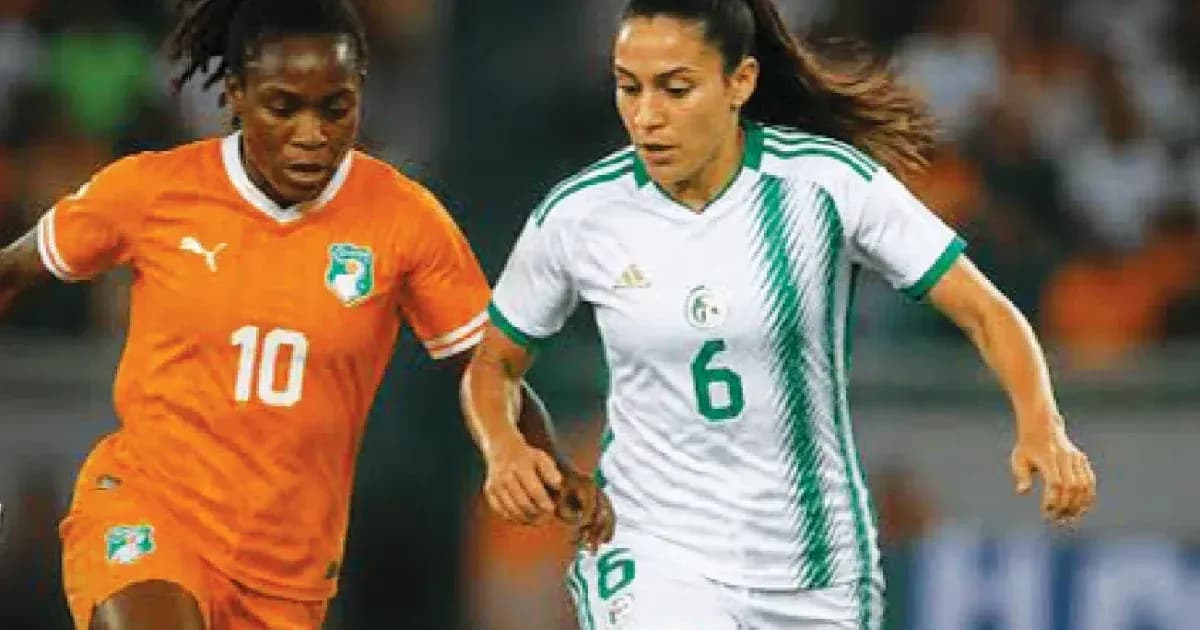 Two female players competing for the ball