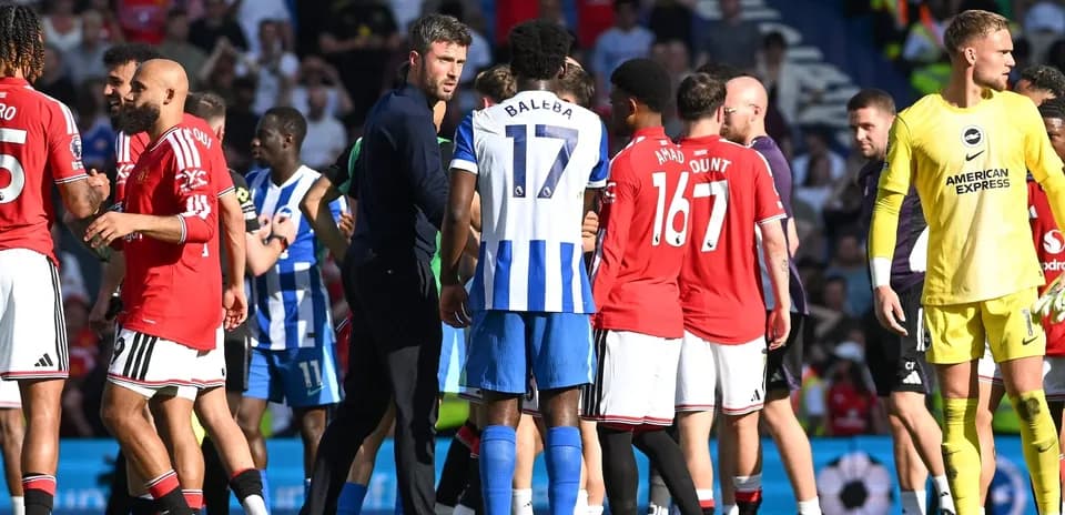 Players from Manchester United and Brighton interacting on field
