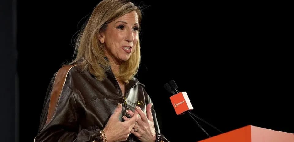 Speaker addressing audience at podium during event