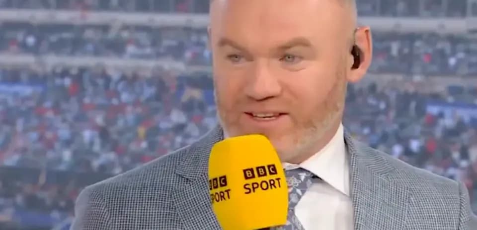 Sport commentator speaking with microphone at event