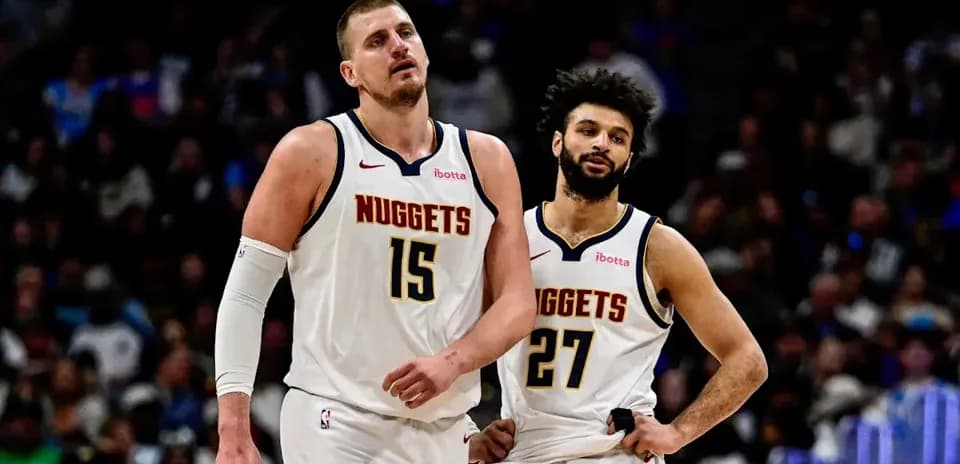 Denver Nuggets players walking off the court