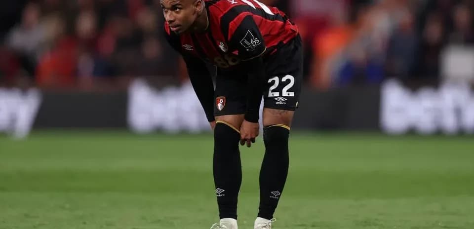 Bournemouth player bending over on the pitch