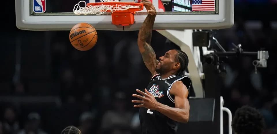 Kawhi Leonard dunking during NBA game action