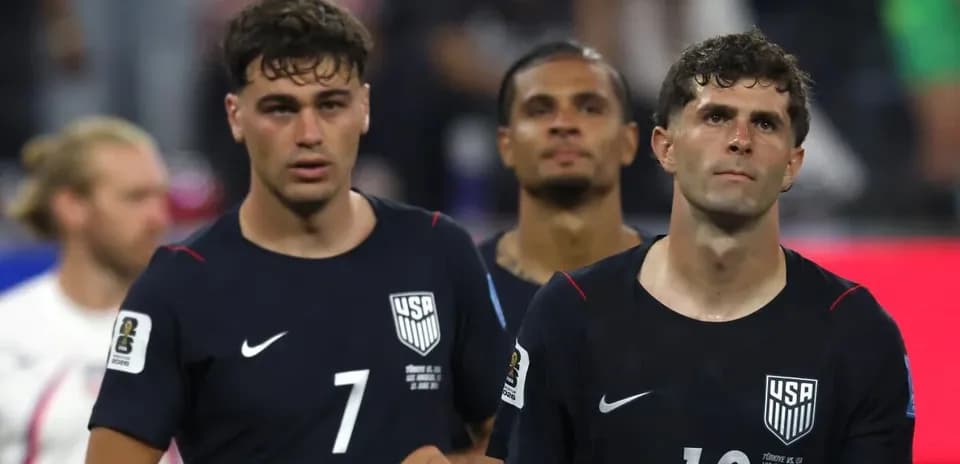 USMNT players walking off the field after match