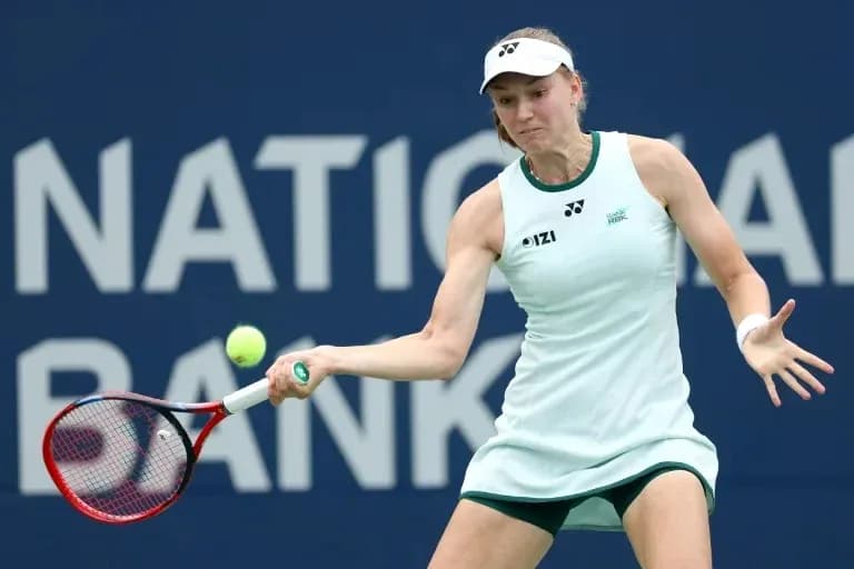 Tennis player hitting a forehand during match