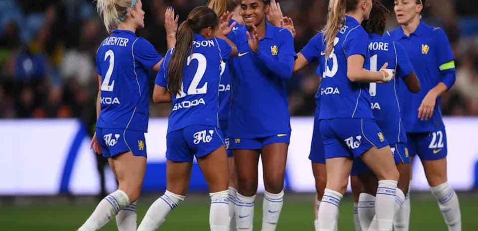 Football team celebrating a goal on the pitch