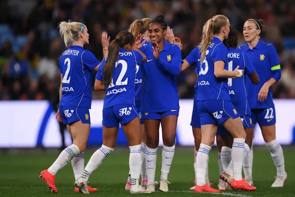 Football team celebrating a goal on the pitch