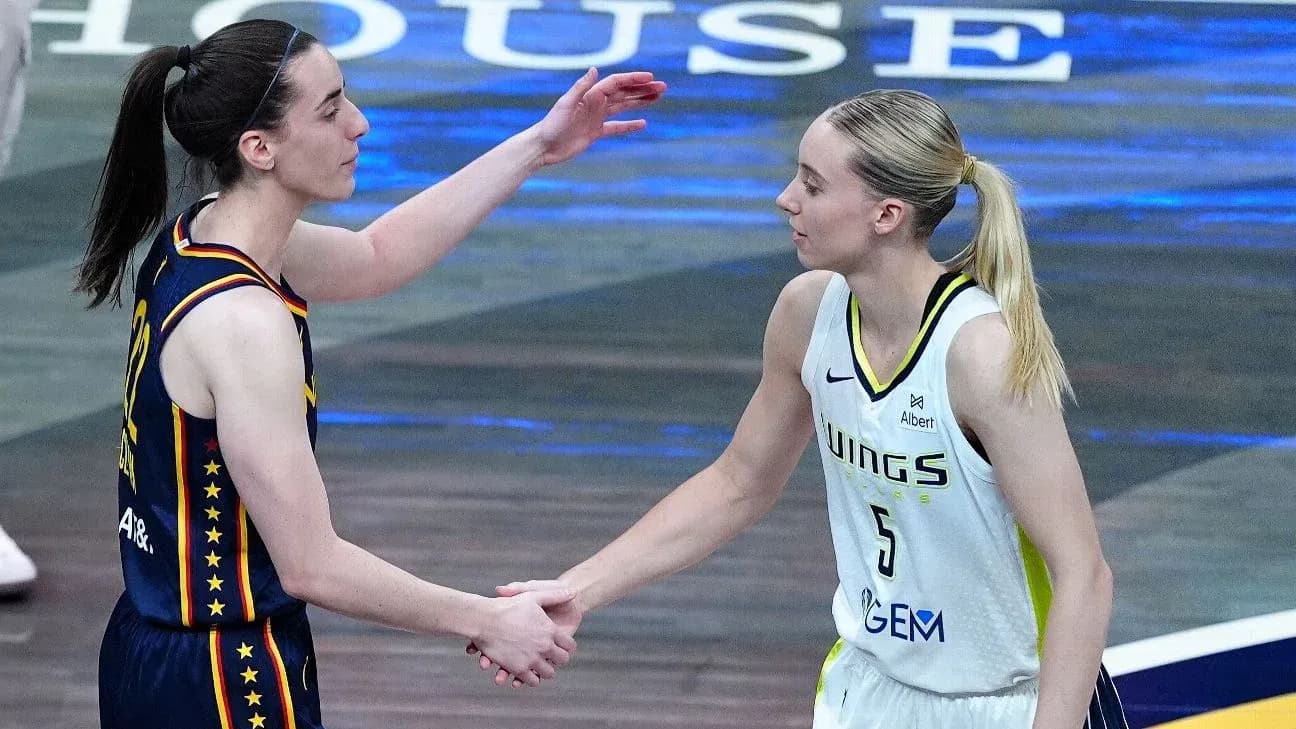 Two basketball players shaking hands after a game