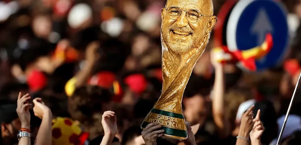 Fan holding FIFA World Cup trophy in crowd