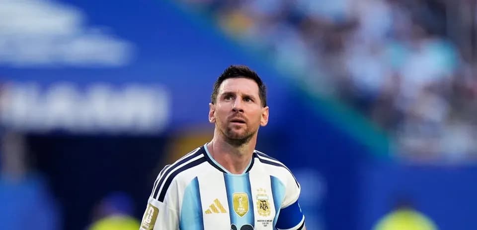 Messi looking up during a match in Argentina jersey