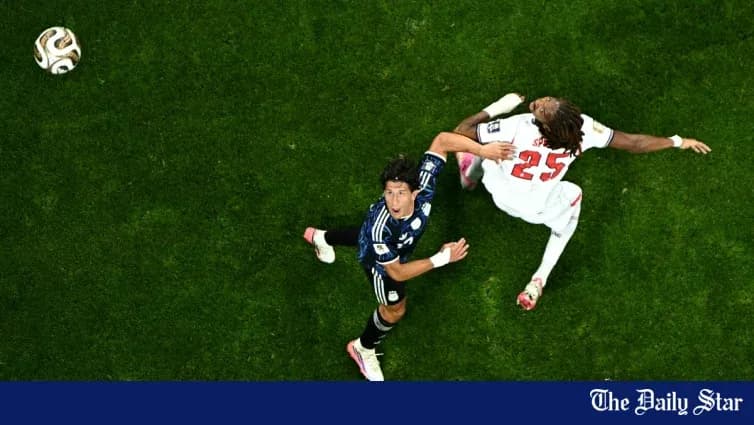 Player falling as opponent challenges for the ball