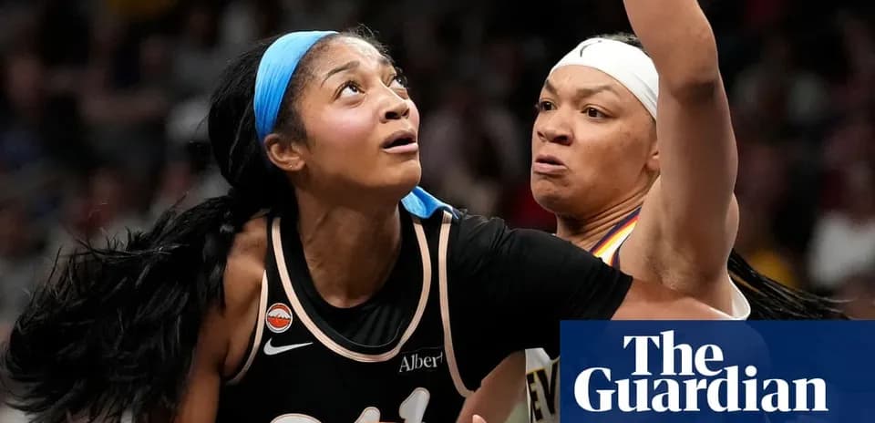 Two basketball players battling for position under the basket