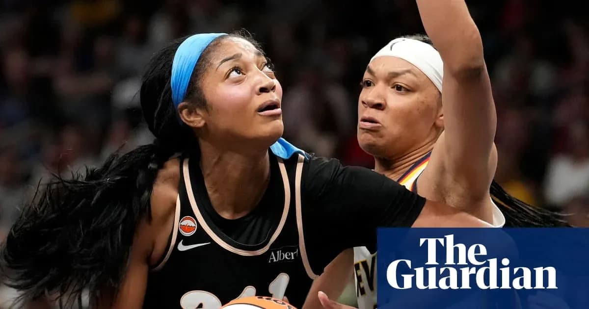 Two basketball players battling for position under the basket