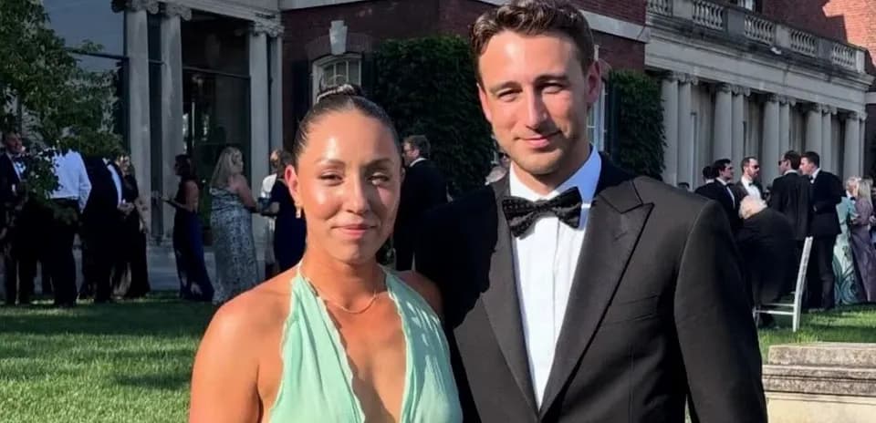 Couple posing at outdoor formal event