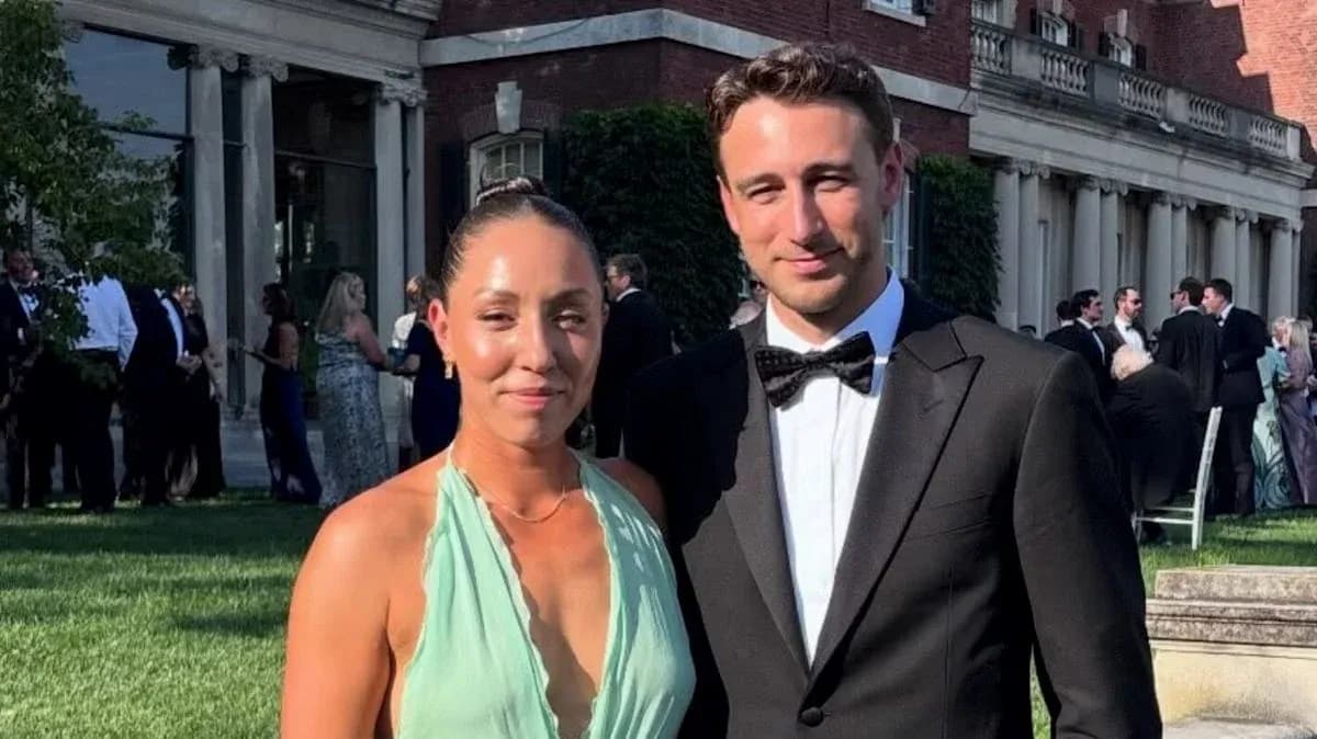 Couple posing at outdoor formal event