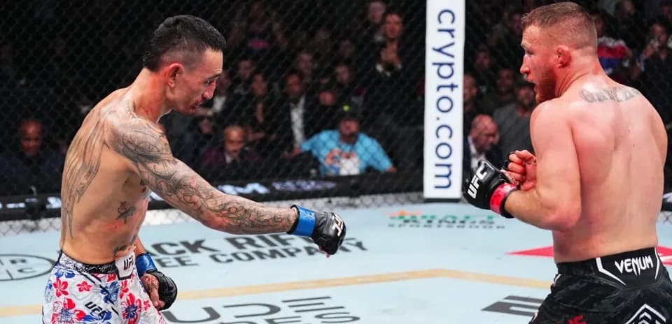 Two fighters exchanging punches in the octagon