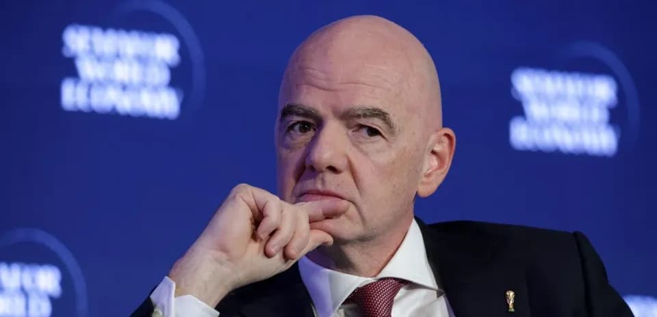 Man pondering during a conference discussion