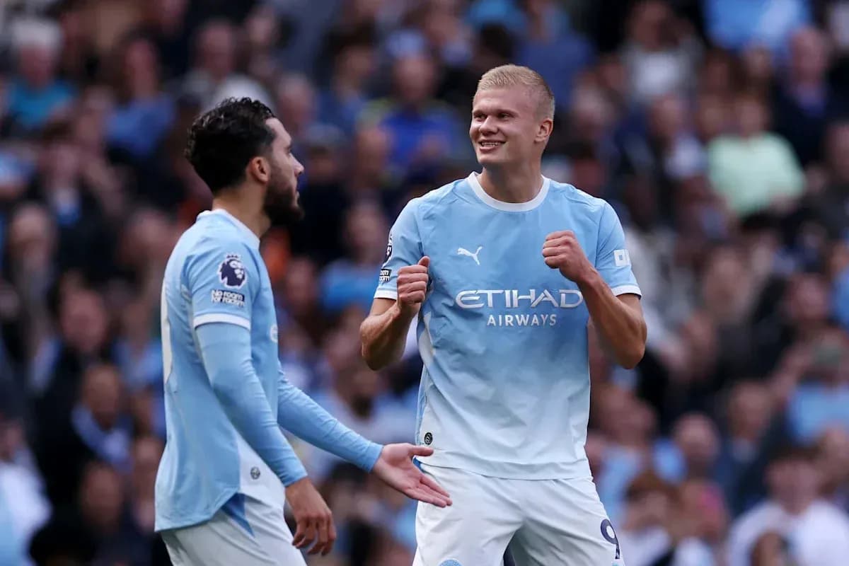 Manchester City players celebrating on the pitch