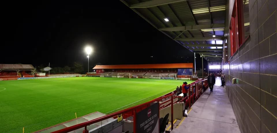 Stadium view with empty pitch and seating area