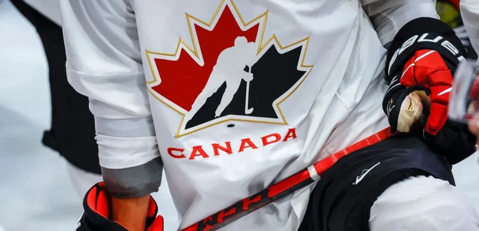 Hockey player wearing Canada jersey and gloves