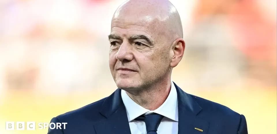 FIFA president standing during event at stadium