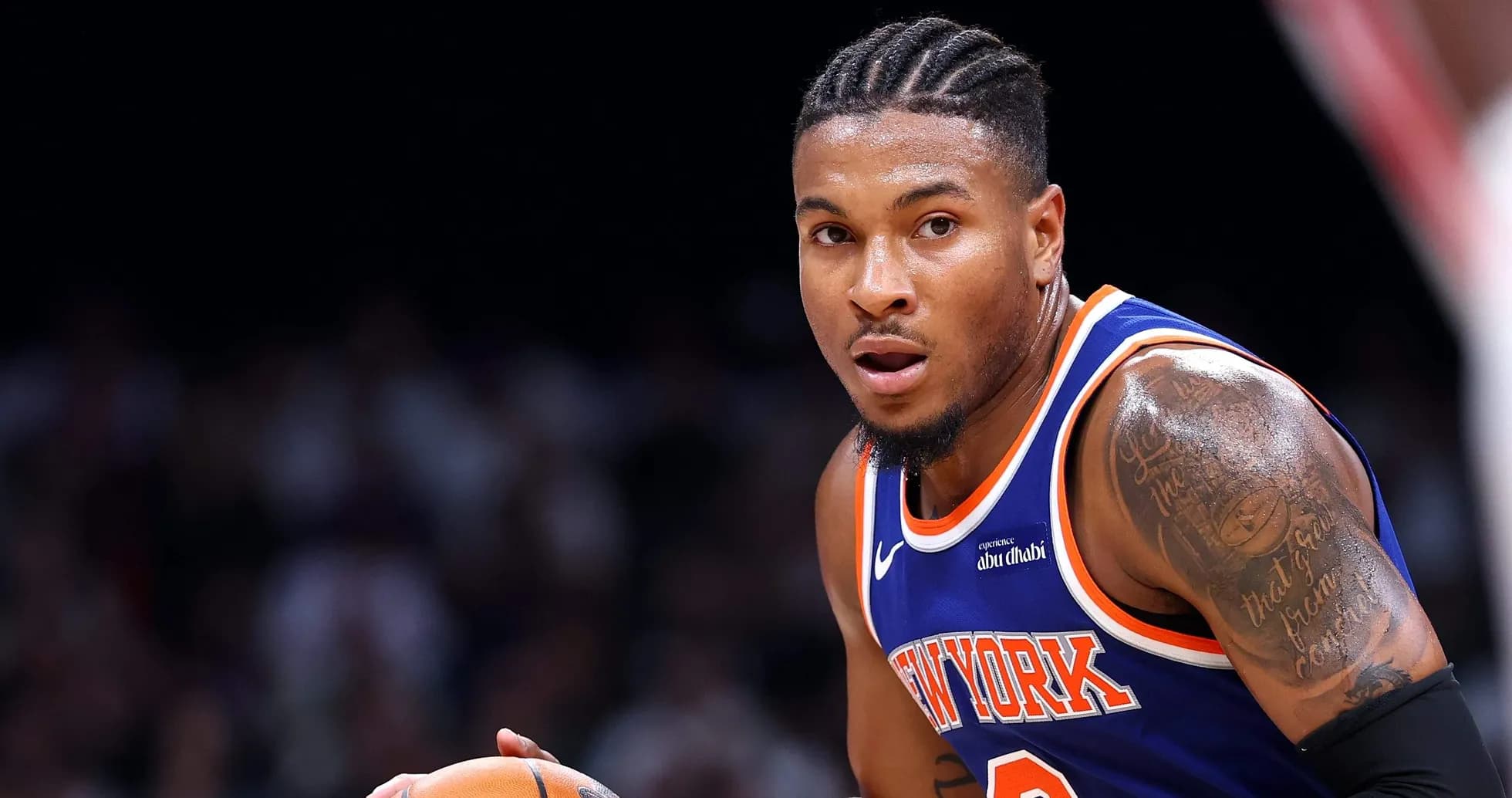 Basketball player dribbling ball during game