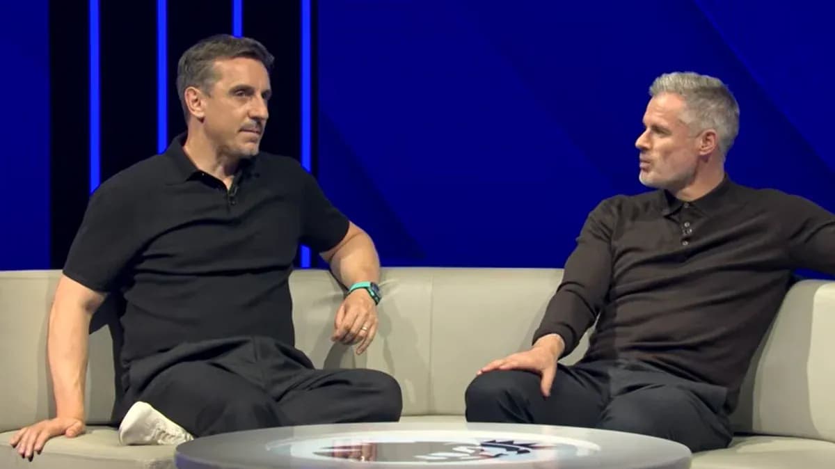 Analysts discussing on a sofa during broadcast