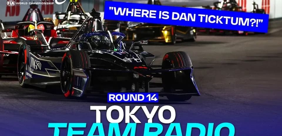 Formula E cars racing in Tokyo during Round 14