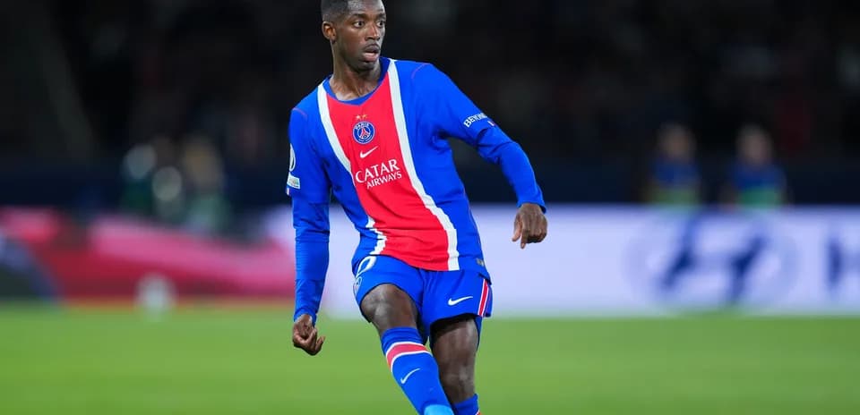 PSG player dribbling during match at stadium