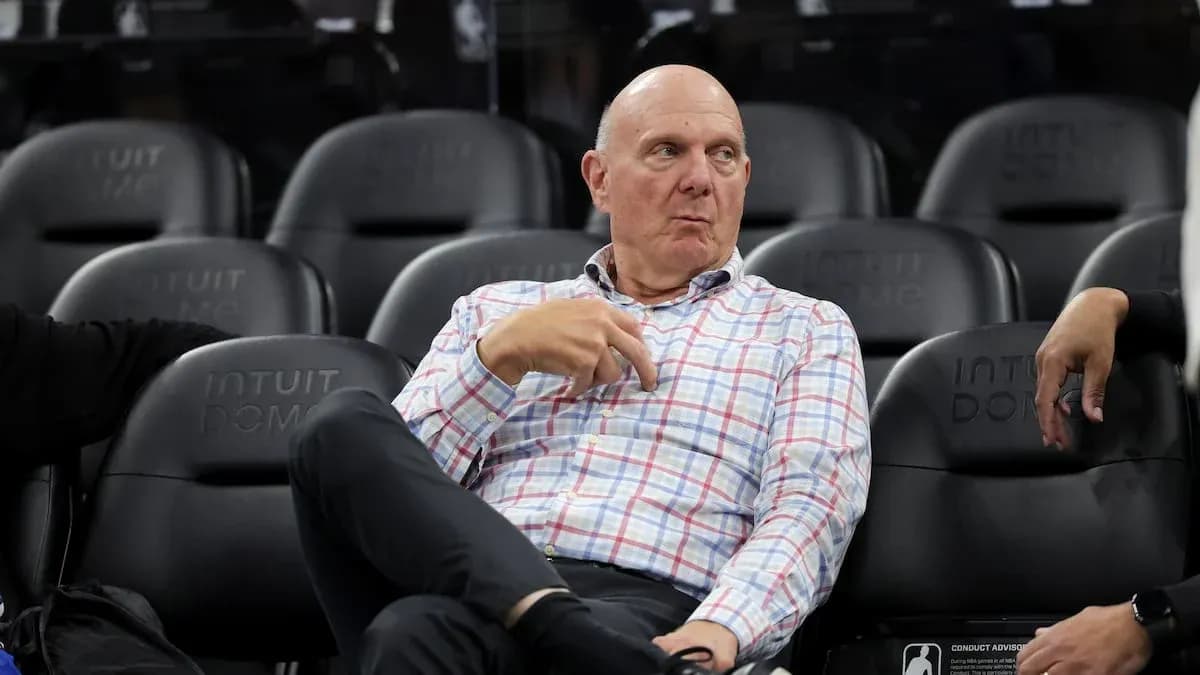 Man sitting in arena seats during a game