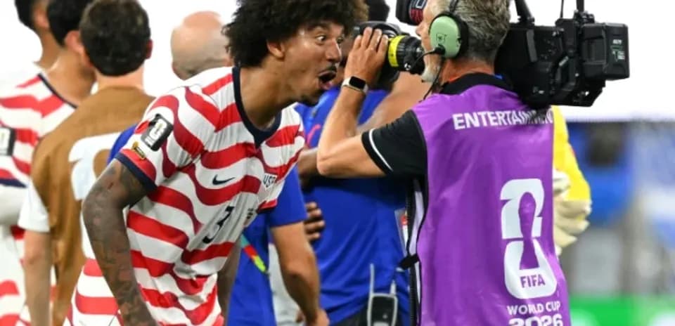 US player celebrating and speaking to cameraman