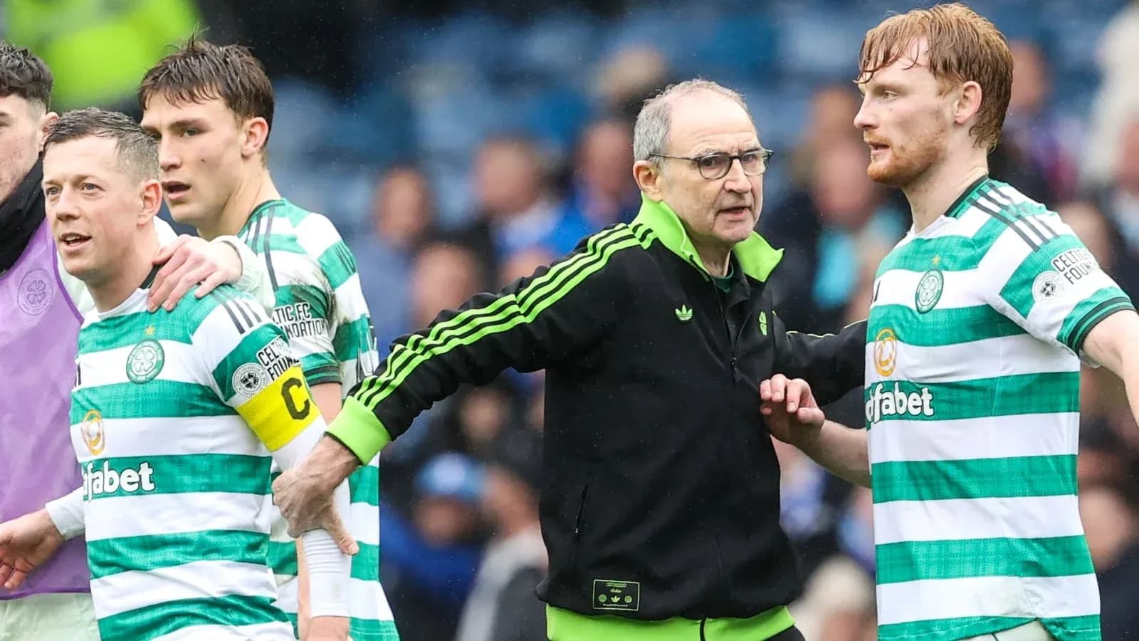 Celtic players and coach discussing during match