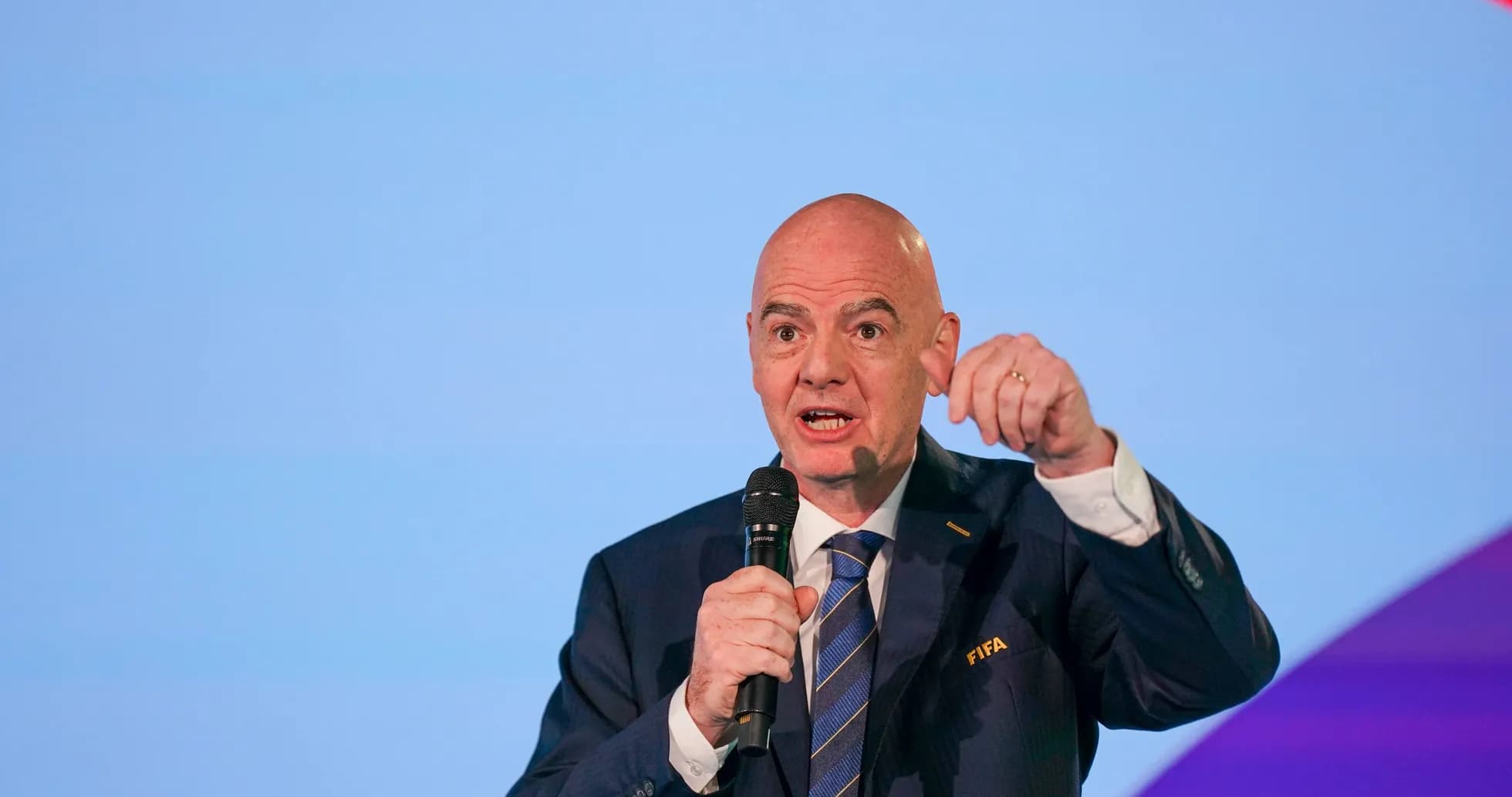 FIFA official speaking at a podium event