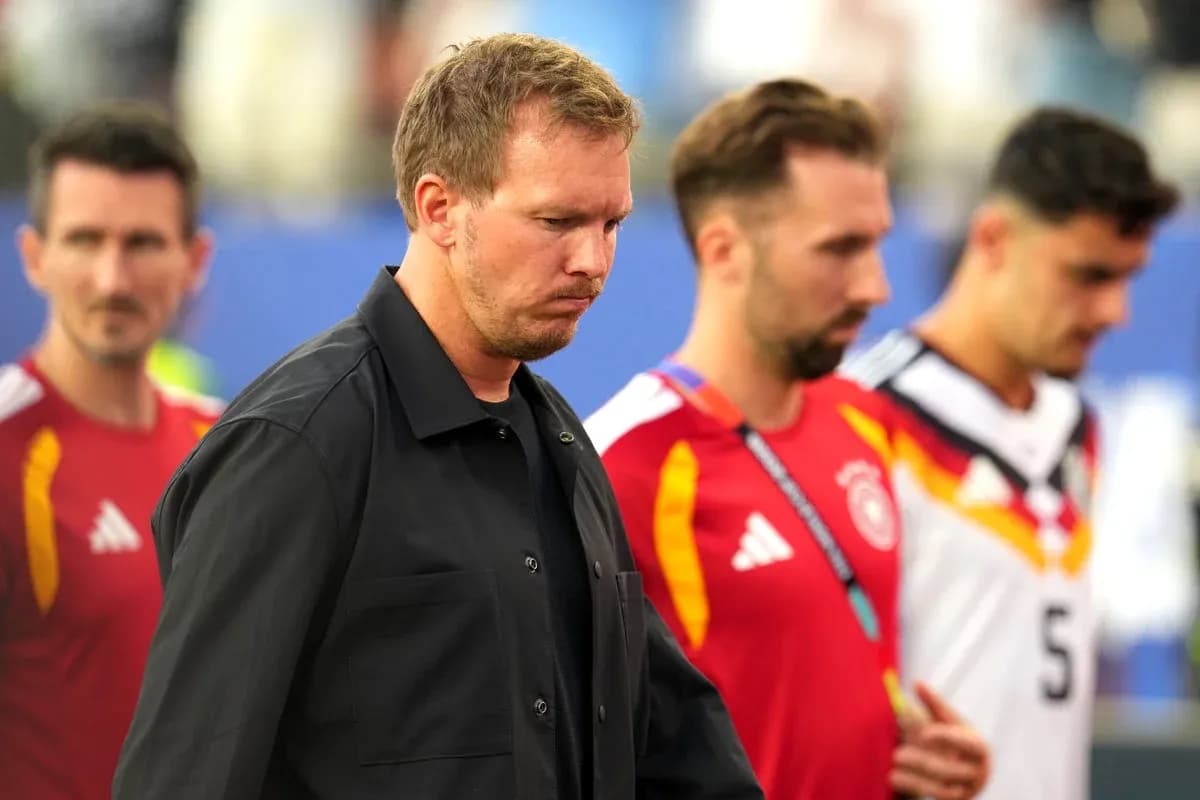 Trainers and players walking off the pitch