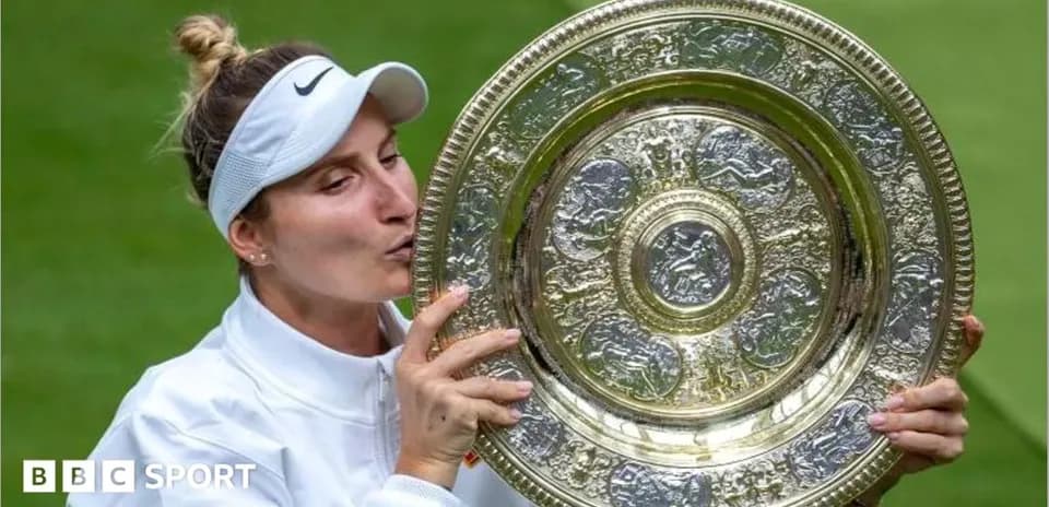 Tennis player celebrating with trophy after victory