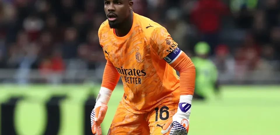 Goalkeeper in orange kit ready for action
