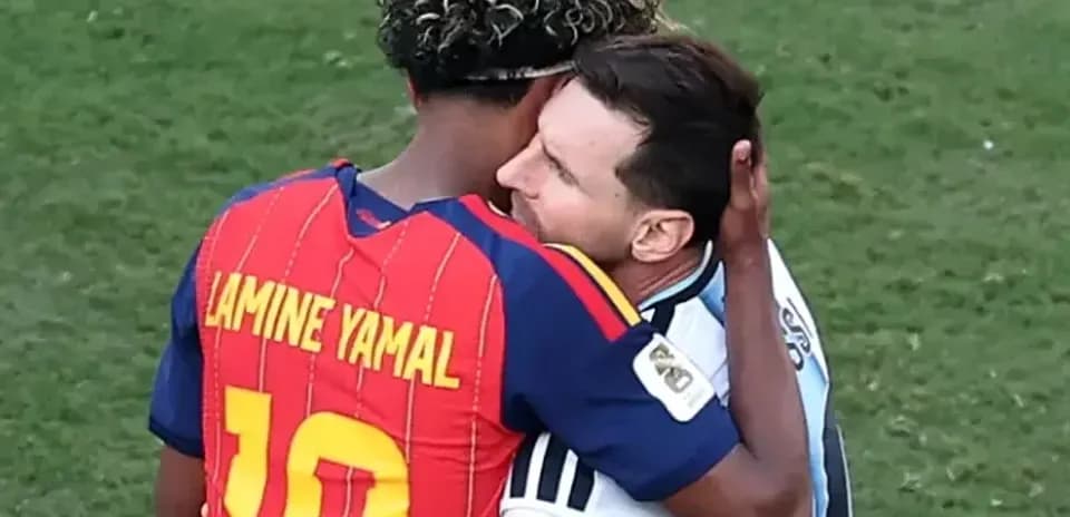 Players embracing after the match on the field