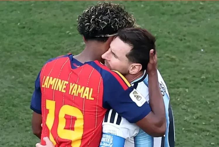 Players embracing after the match on the field