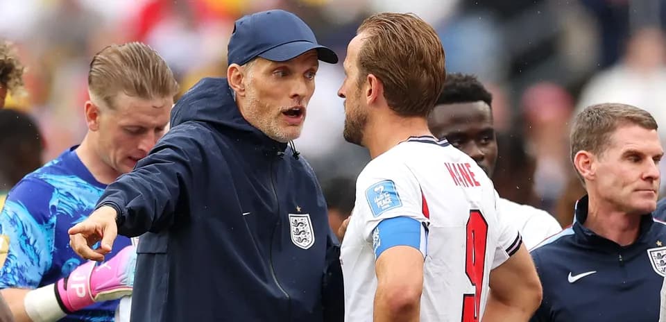 Tommy Tuchel discussing strategy with Harry Kane
