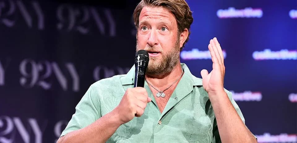 Speaker discussing at event with microphone in hand