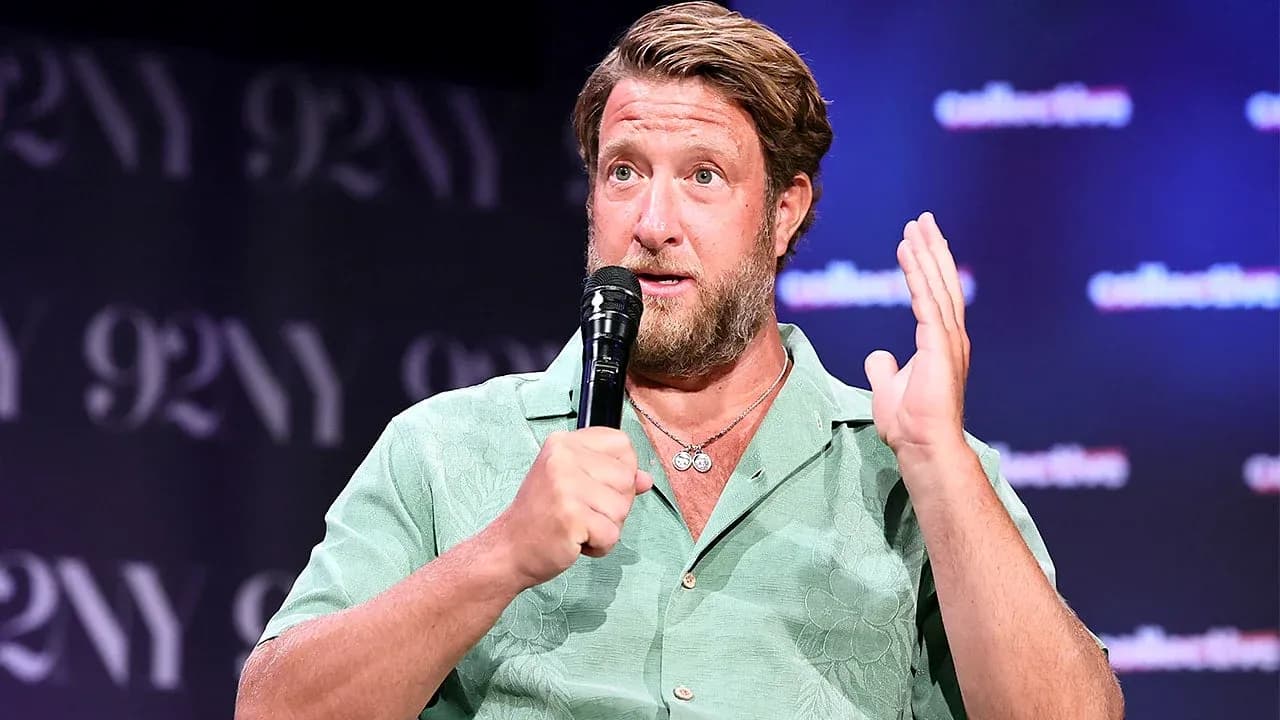 Speaker discussing at event with microphone in hand