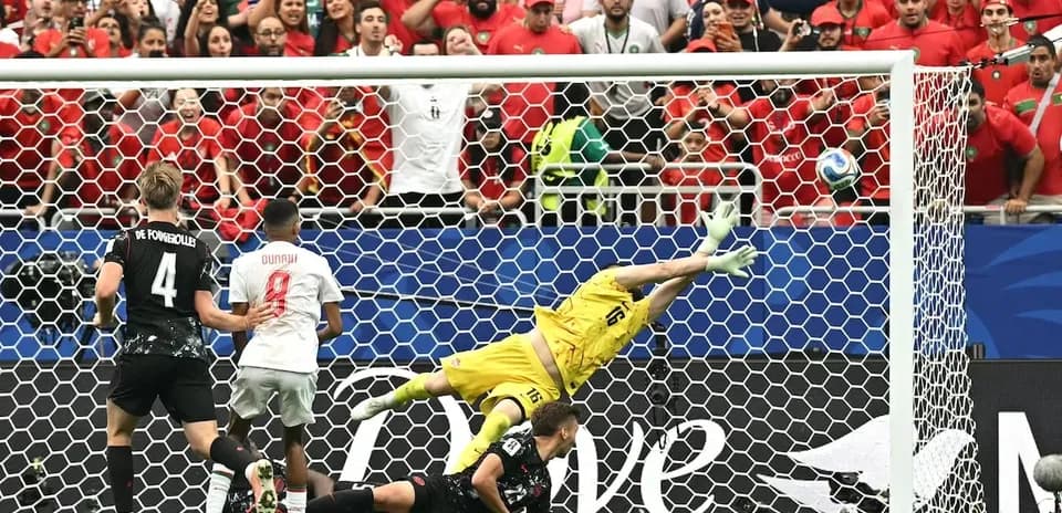 Goalkeeper diving to save a penalty kick attempt