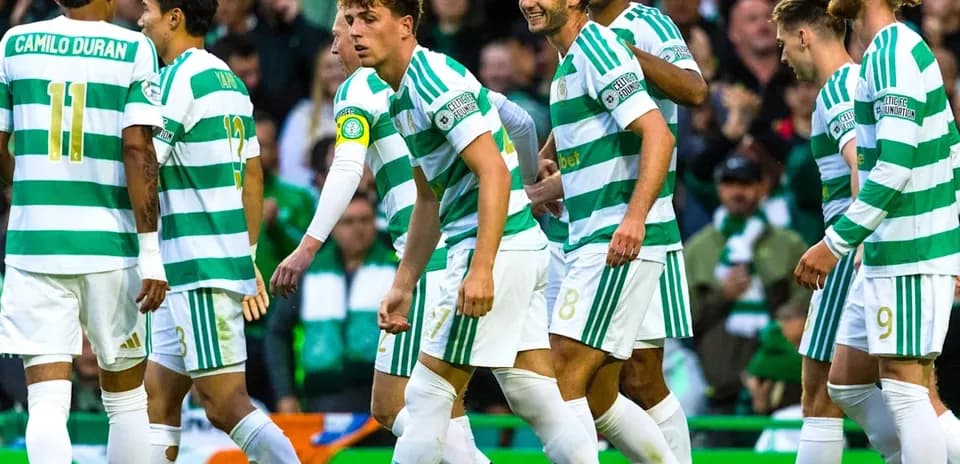 Celtic players celebrating together on the pitch