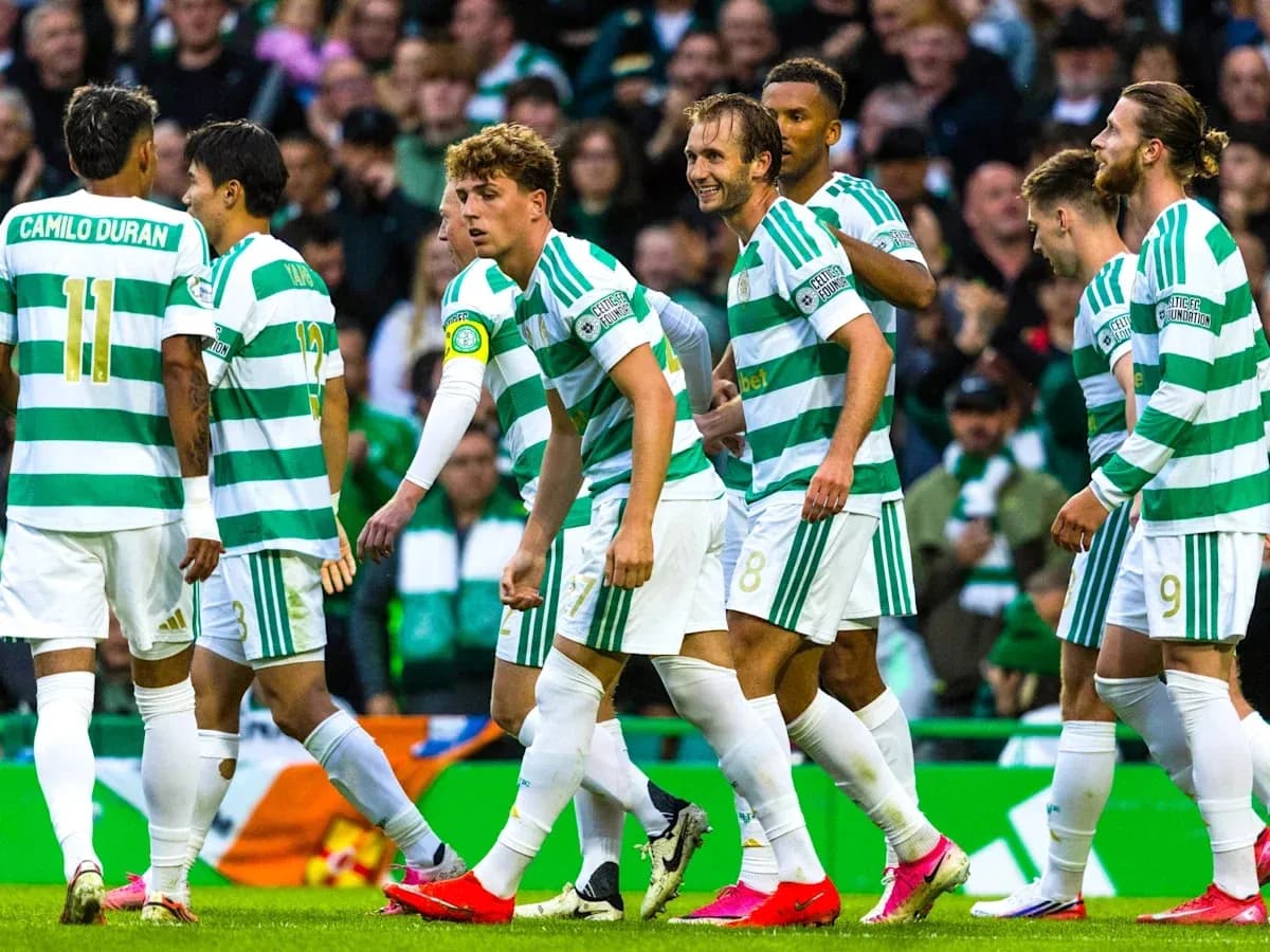 Celtic players celebrating together on the pitch