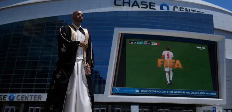 Man in traditional attire outside Chase Center