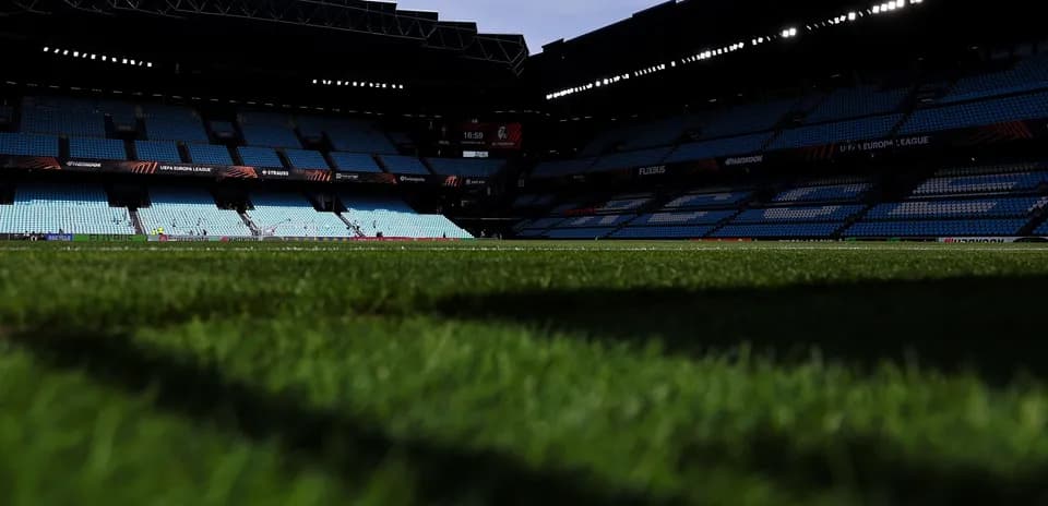 Empty stadium view with focus on grass field